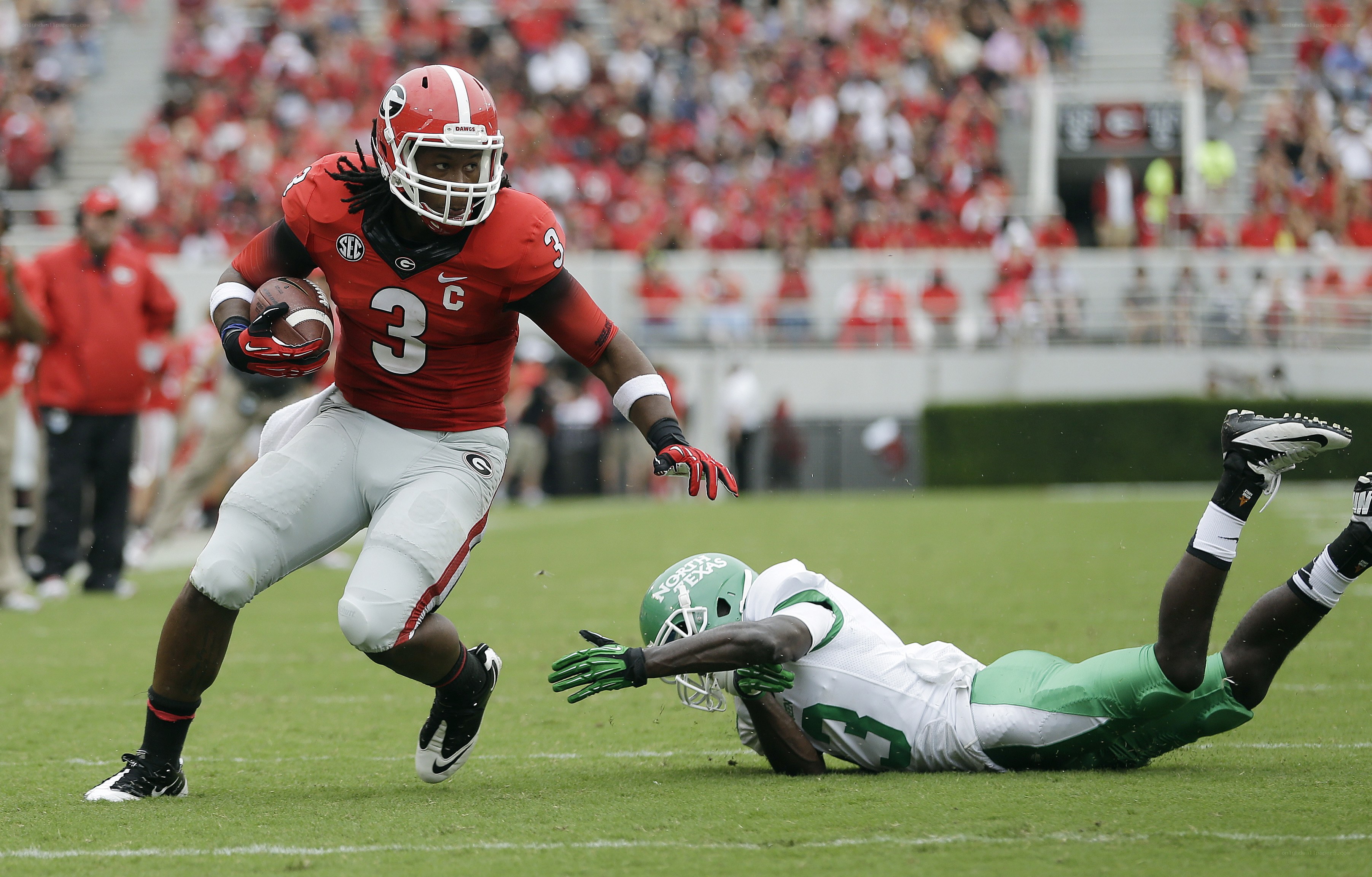 Football player running with ball