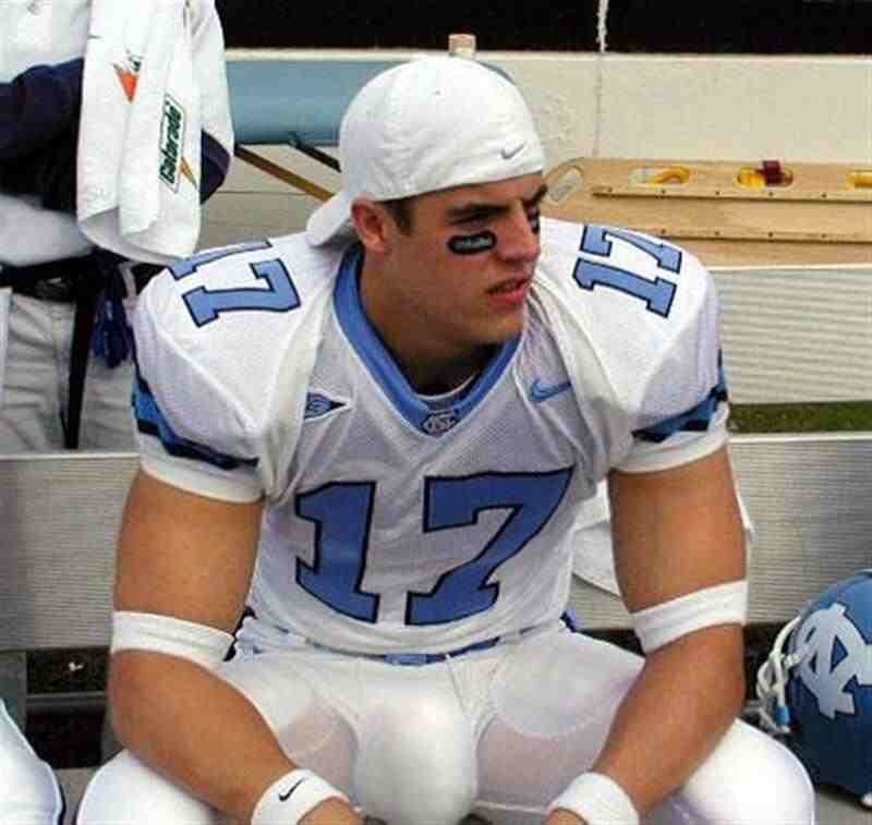 football player sitting on bench