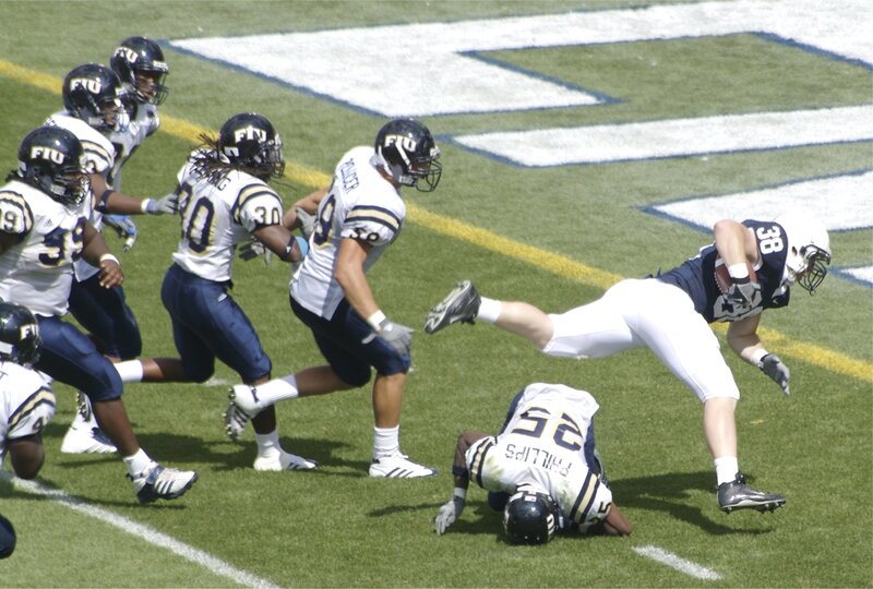 Football Player Tackling