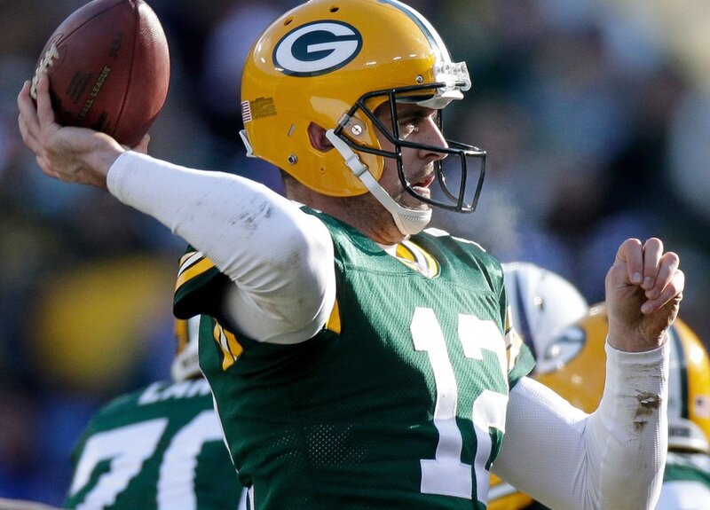 Football Player Throwing Ball — Green, Focused