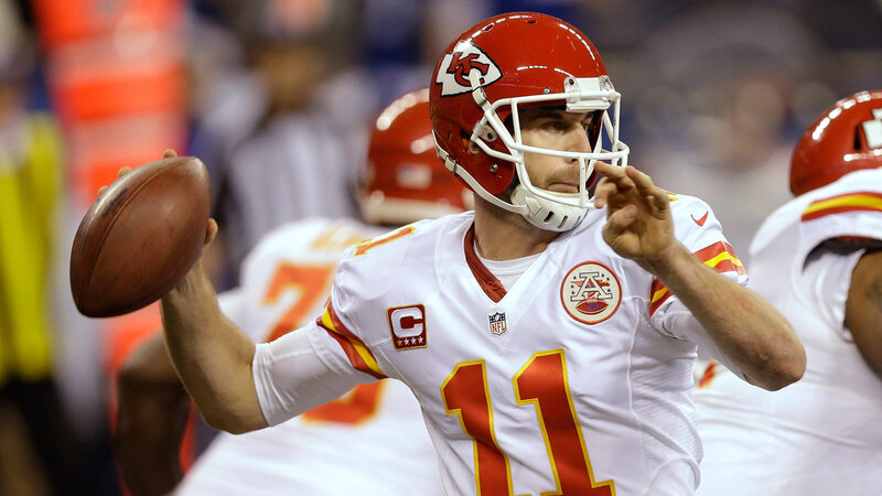 Football Player Throwing Ball — Red, Focused