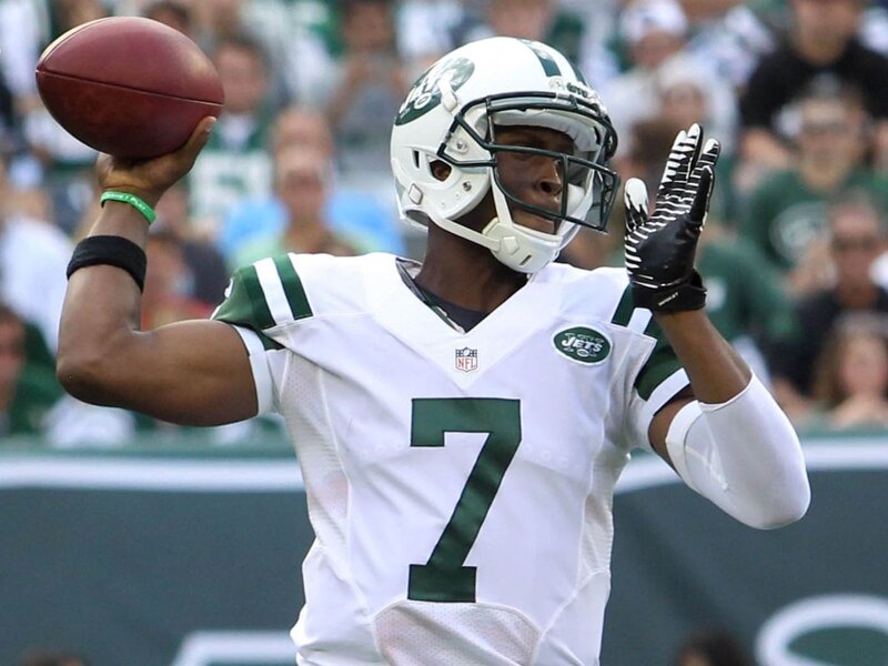Football Player Throwing Ball — White, Focused