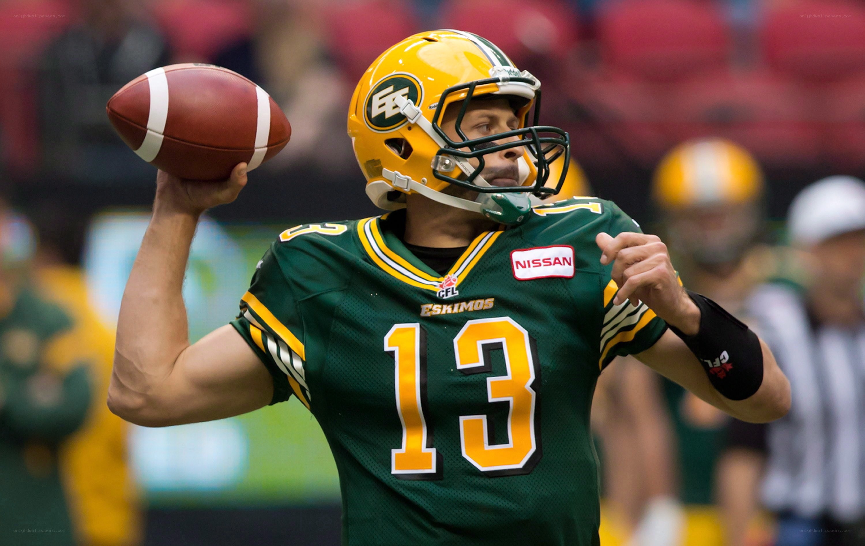 football player throwing ball