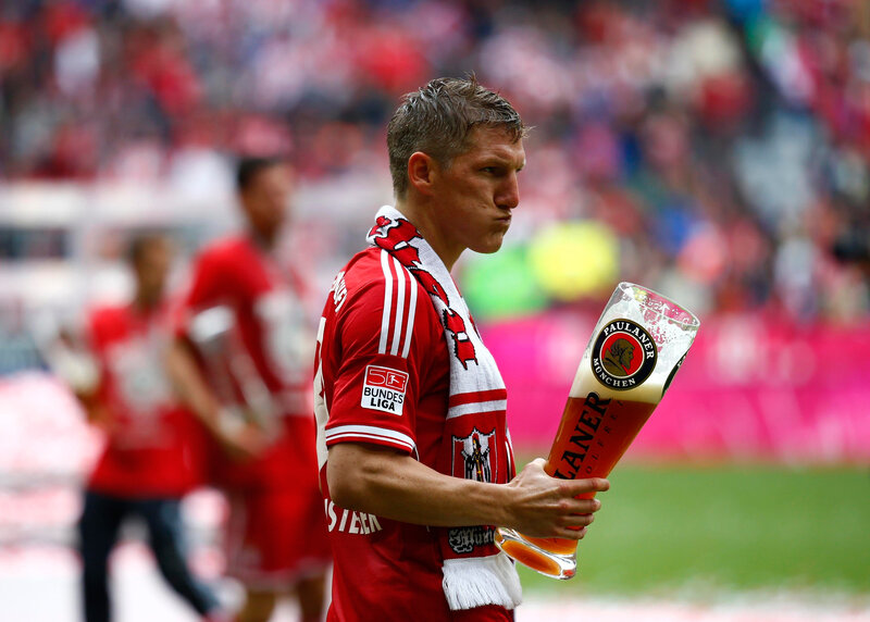 Football player with beer glass