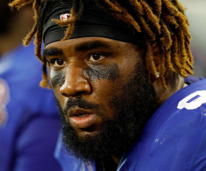 football player with dreadlocks
