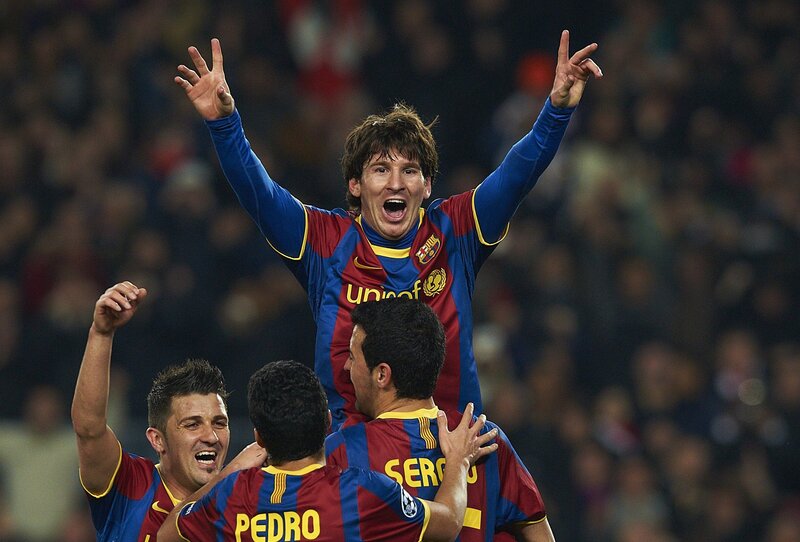 Football players celebrating a goal