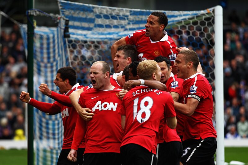 Football players celebrating goal