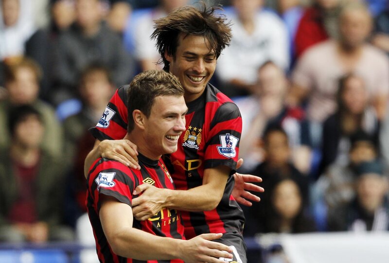 Football players celebrating goal