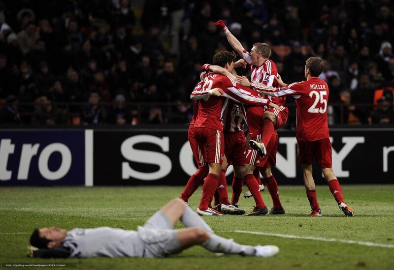 football players celebrating goal