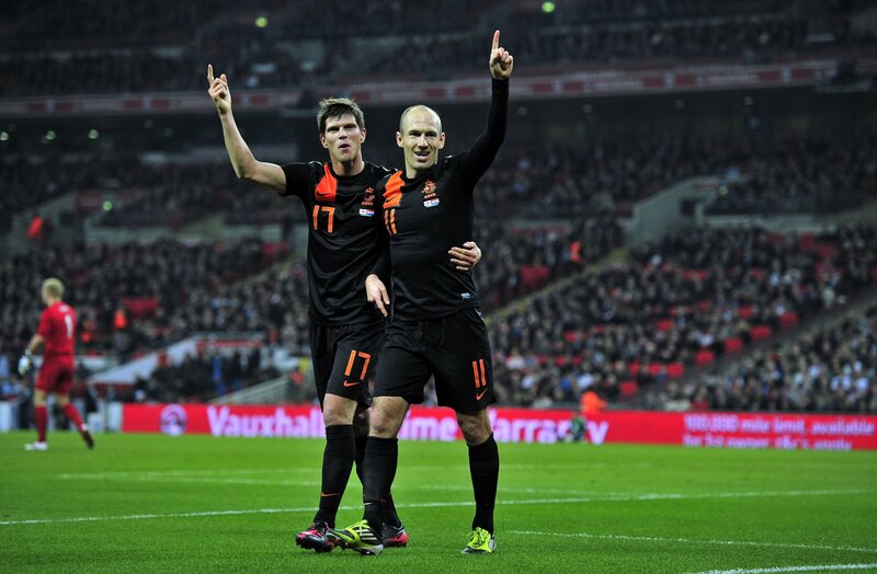 Football players celebrating on field