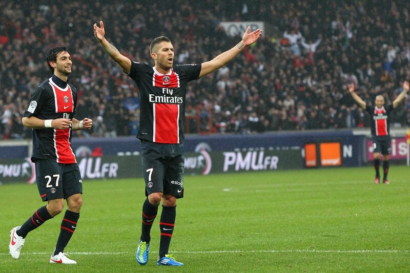 Football players celebrating on field
