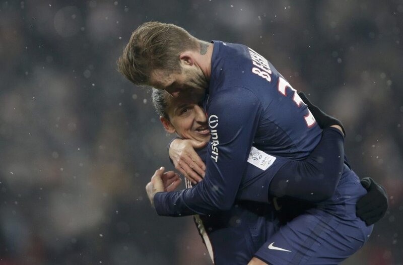 Football players celebrating on field