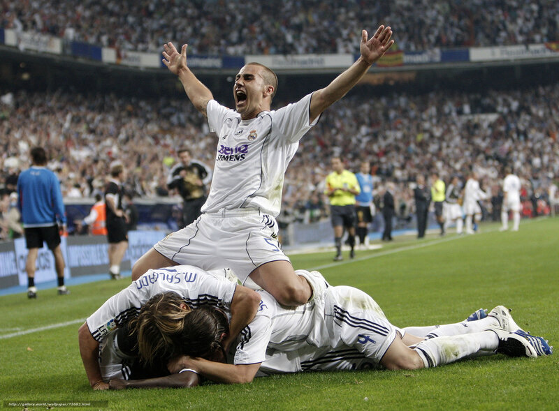 Football players celebrating on field