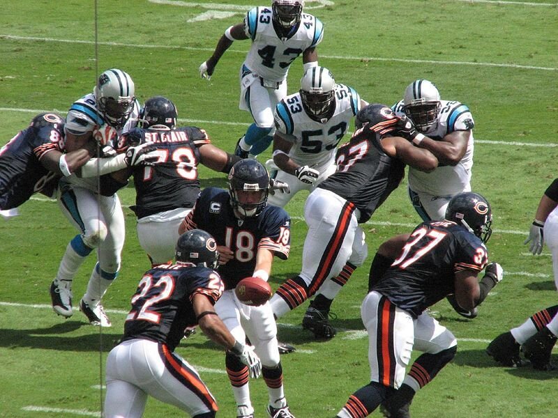 Football Players in Action — Green, Intense, Afternoon