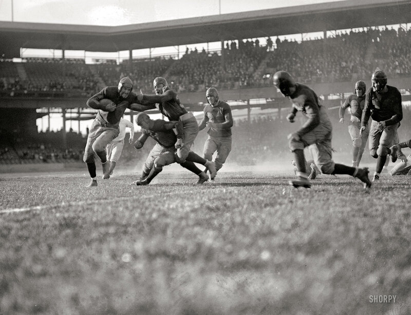 Football players in action on field