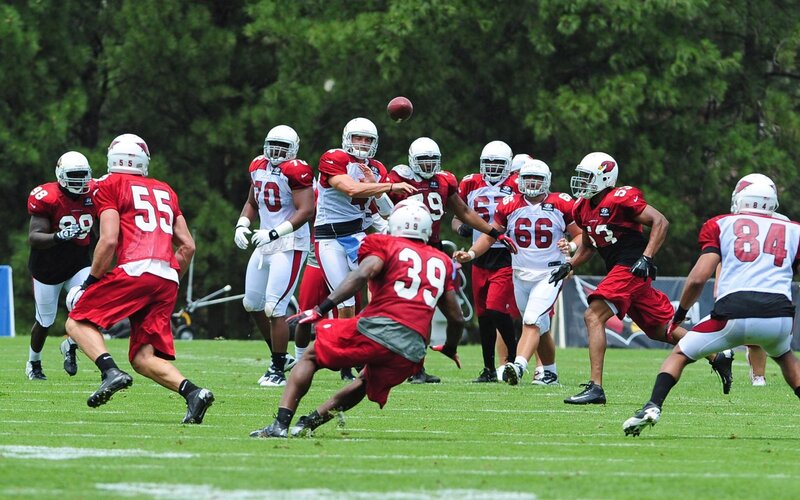 Football Players in Action — Red, Active
