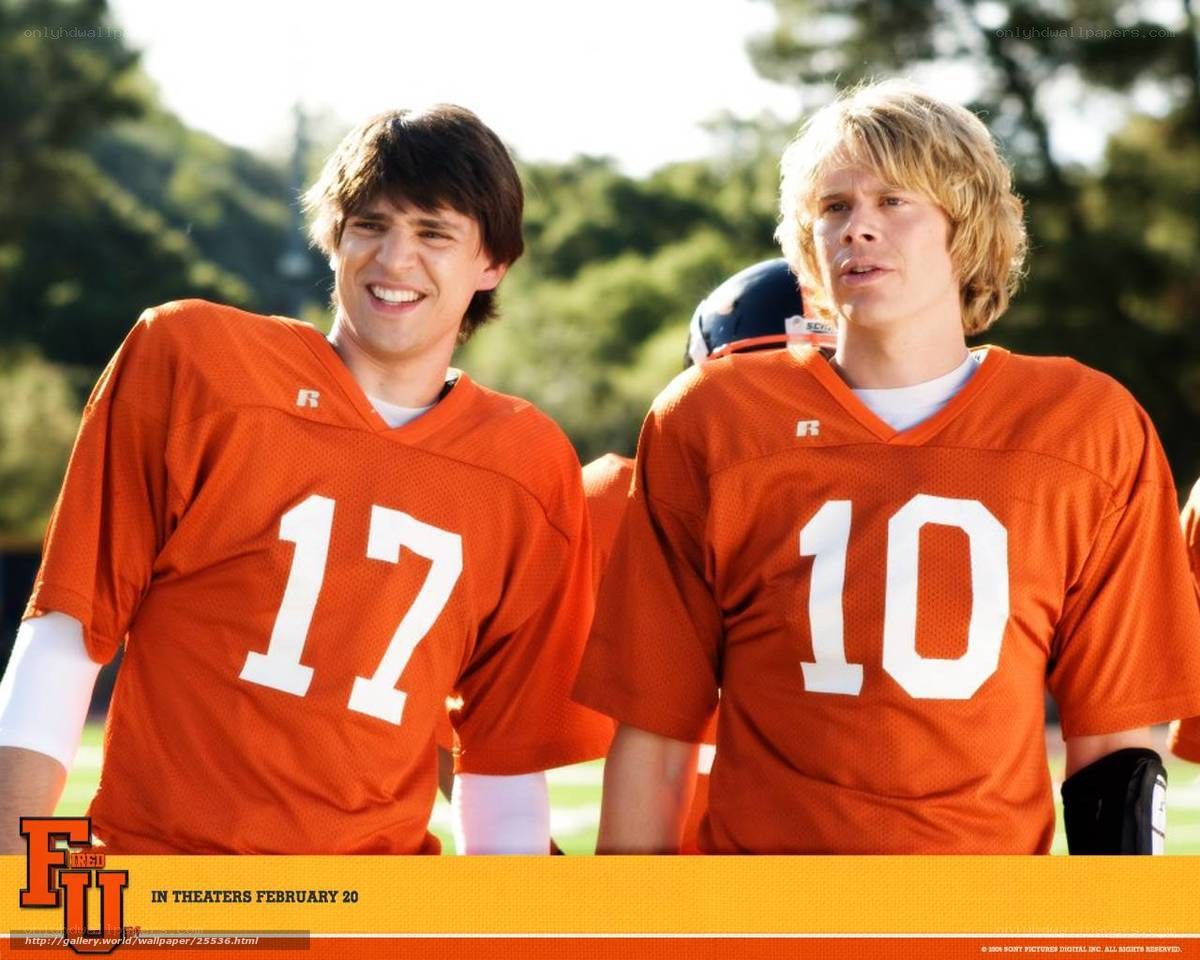 football players in orange jerseys