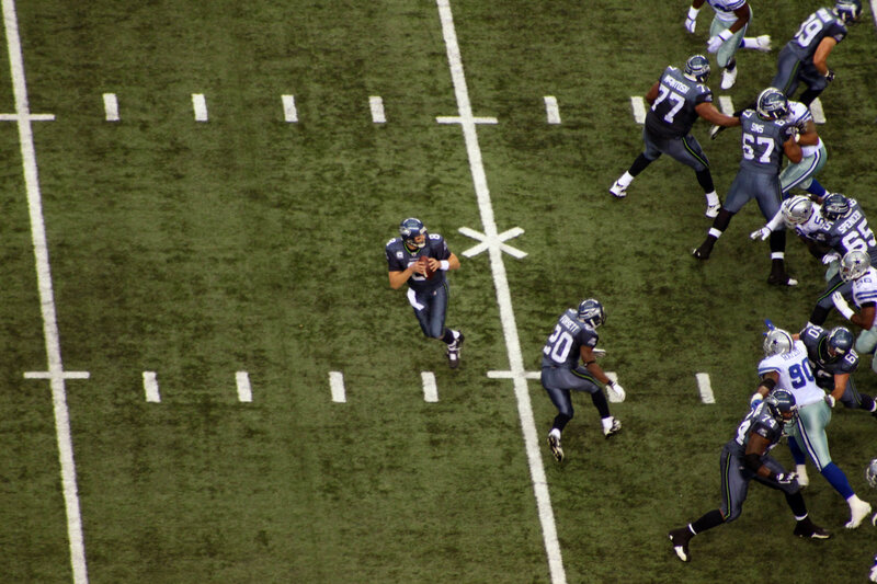 Football Players on Field — Green, Competitive, Photograph