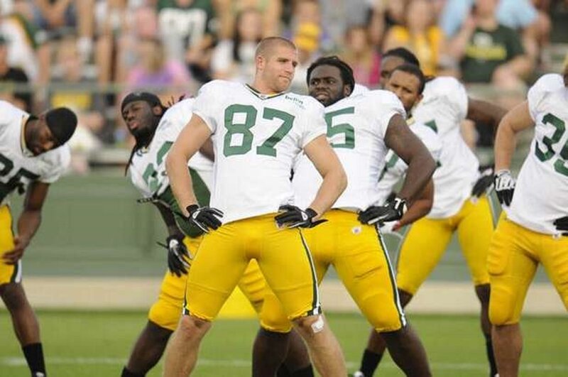 Football Players on Field — White, Focused