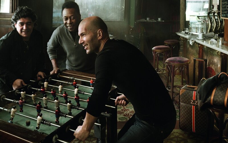 Football players playing foosball