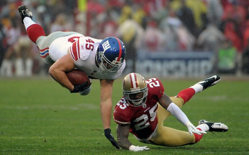 Football Players Tackling — Green