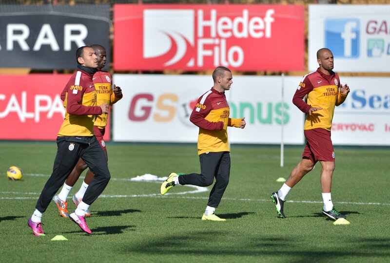 Football players training on field