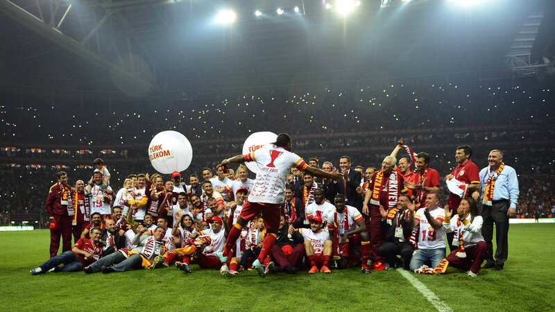Football team celebrates on field