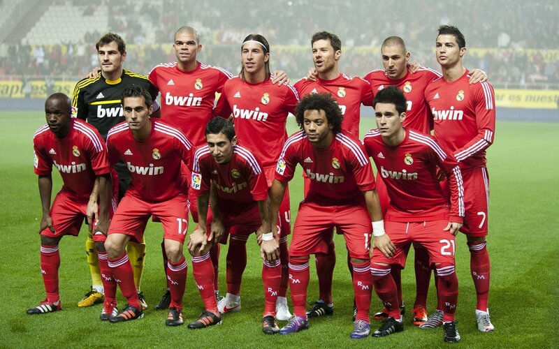 Football Team on Field — Red, Serious