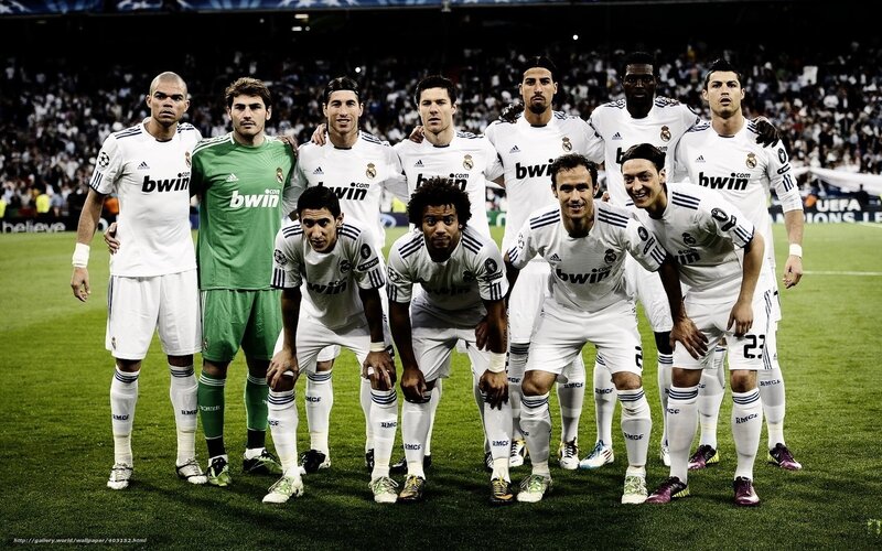 Football Team on Field — White, Serious