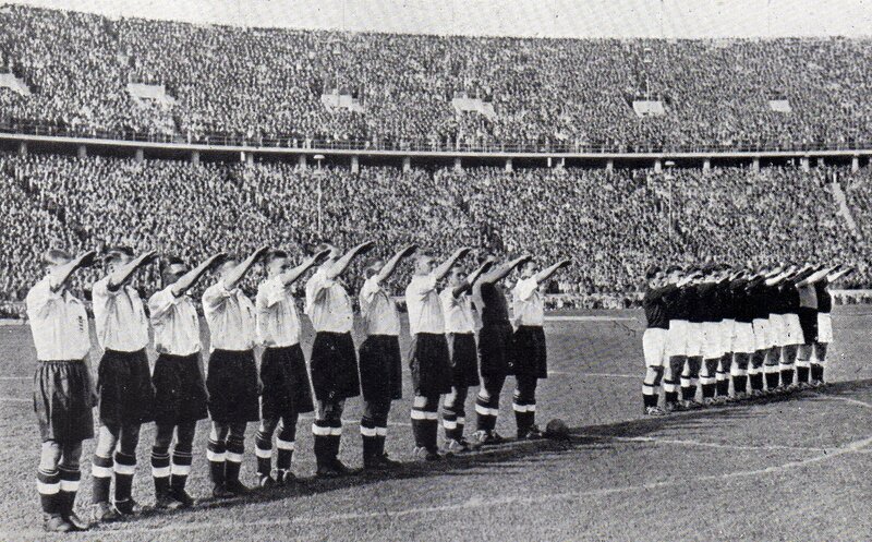 Football teams salute at stadium