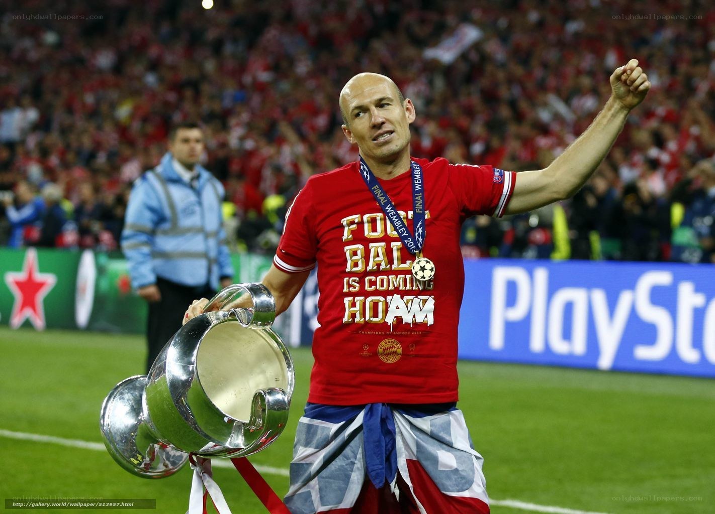 Footballer holding trophy