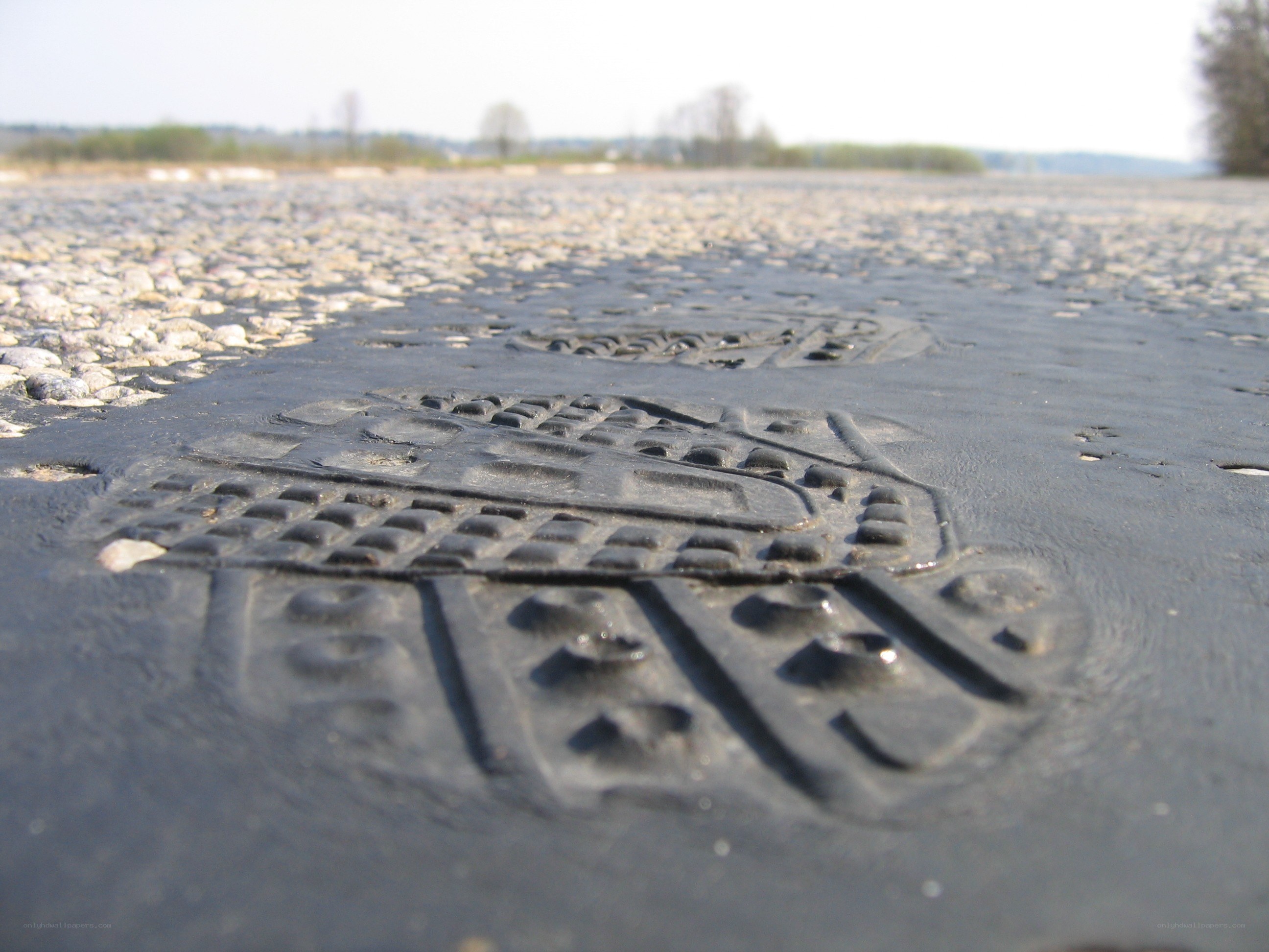 footprint impressions on pavement