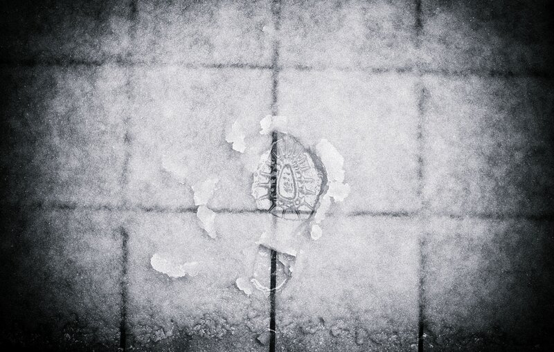 Footprint in Snow — Black