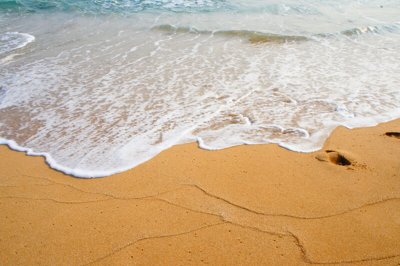 Footprints in Wet Sand — Brown