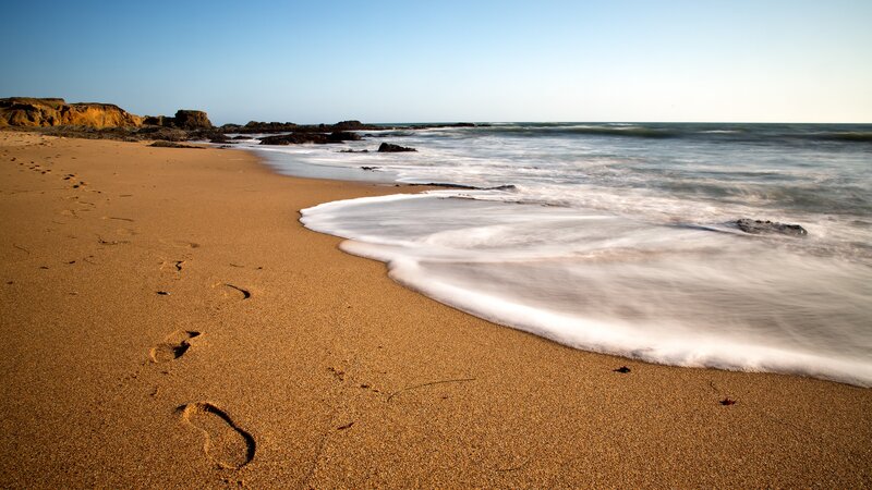 Footprints on a sandy beach