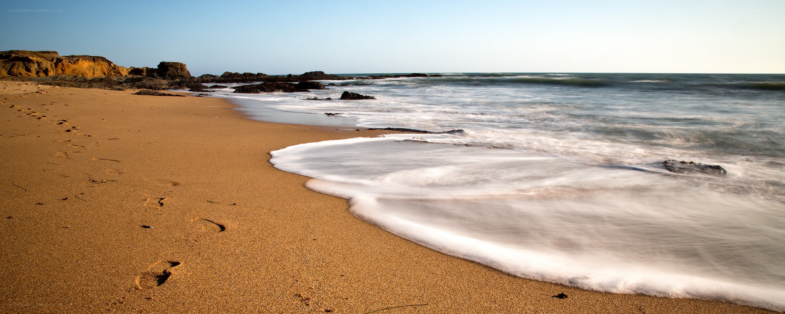 Footprints on a sandy beach