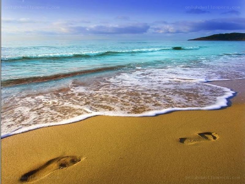 Footprints on a sunny beach