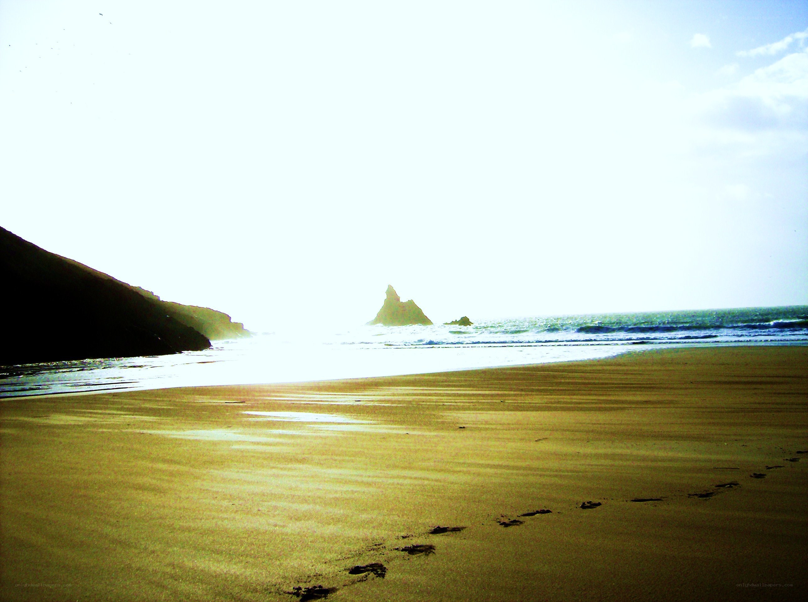 Footprints on a sunny beach