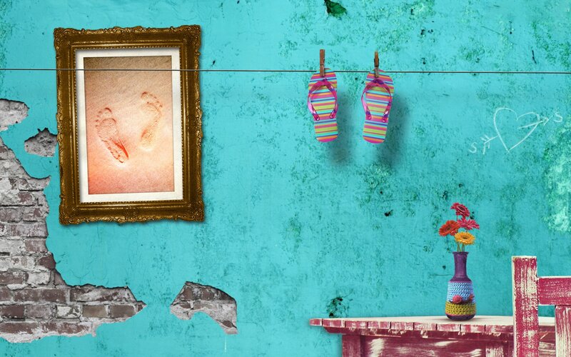 Footprints on a turquoise wall