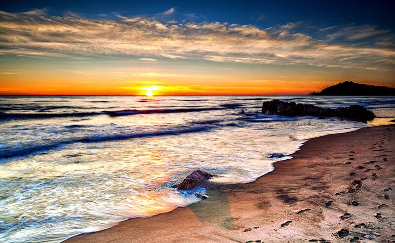 Footprints on Beach at Sunset — Orange