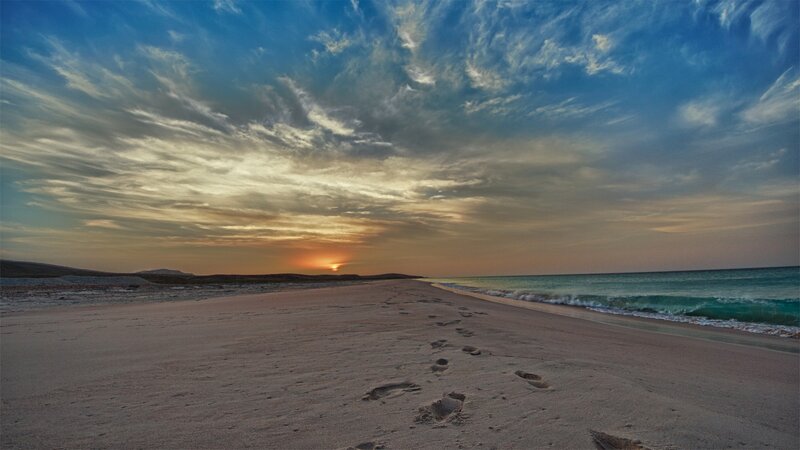 Footprints on Beach — Blue, Serene, Sunset