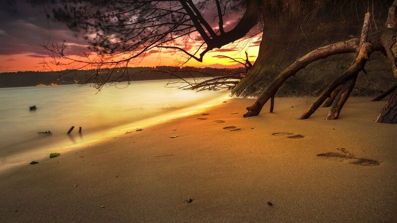 Footprints on Beach — Orange, Serene
