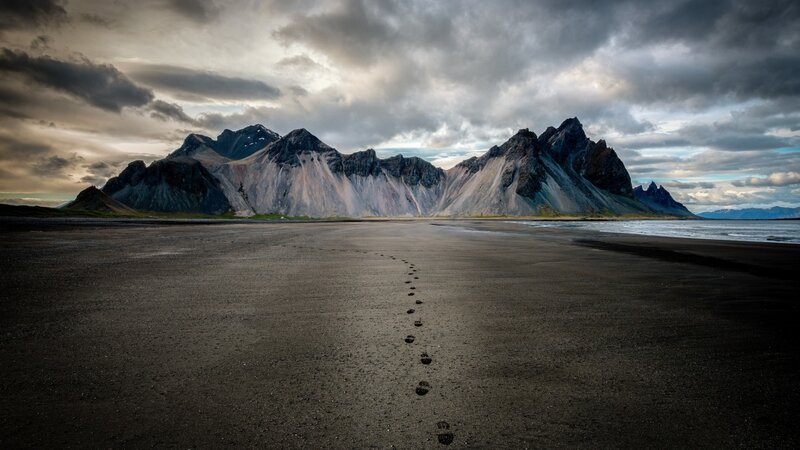 Footprints on Black Sand