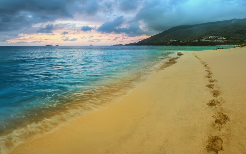 Footprints on Sandy Beach — Blue, Serene, Sunset