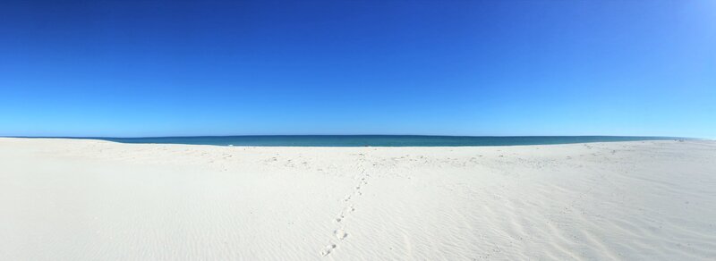 Footprints on White Sand — Serene