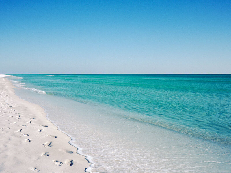 Footprints on White Sand