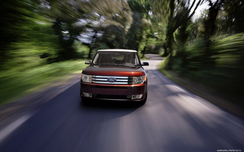 Ford Flex driving on a forest road