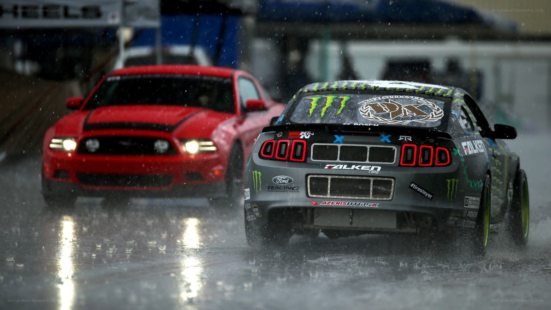 Ford Mustangs racing in rain