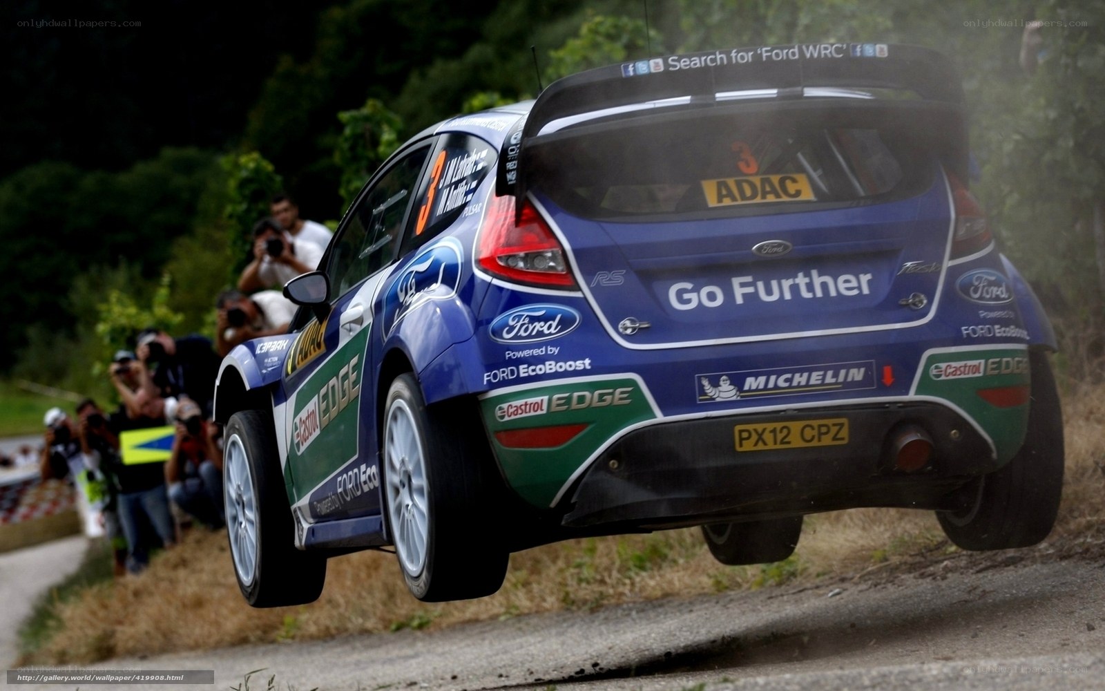 Ford rally car in mid-air jump