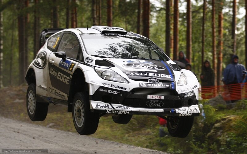 Ford rally car in mid-air jump